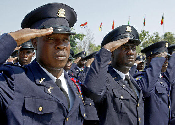 National Haitian police stand at attention. Three years after Canada promised to build the troubled nation a new police academy, work still hasn't started.