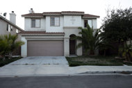 The home of Felicitas Gurrola de Mason is seen Wednesday, Nov. 30, 2011, in Chula Vista, Calif. Gurrola, 84, will be sentenced on Thursday after she pleaded guilty to charges that she directed a smuggling organization that guided migrants across the heavily fortified U.S.-Mexico border by giving them imposter IDs to present to immigration authorities at the crossing in San Ysidro, Calif. (AP Photo/Gregory Bull)